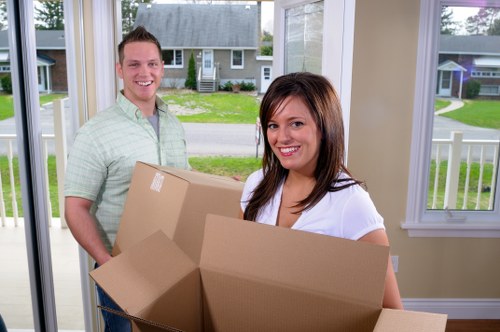 Packing and loading household items for removals in Kilburn