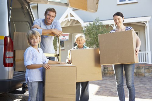 Local movers handling furniture and boxes in Kilburn