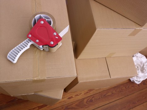 Commercial removals team handling office furniture in Kilburn