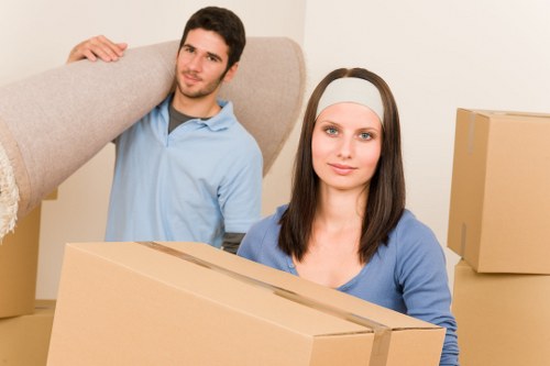 Careful packing of office equipment for a Kilburn workplace relocation