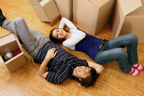 Professional local movers handling furniture in Kilburn